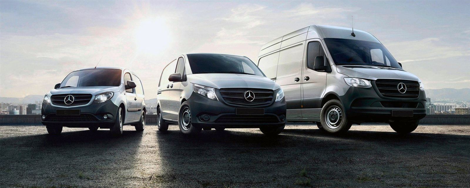 Three Mercedes minibuses parked side by side